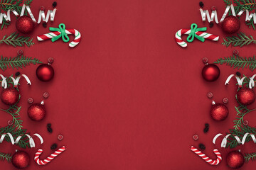 New Year's, festive decor on a red background. Copy space, flat lay, mock up, top view