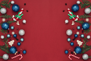 New Year's, festive decor on a red background. Copy space, flat lay, mock up, top view