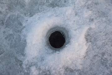 hole in the ice for winter fishing