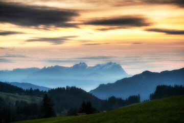 Fototapeta na wymiar Sunset over Mount Saentis in Swiss Alps with Bregenzerwald, Austria, Vorarlberg, in foreground