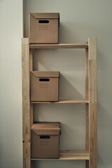 Paper boxes are on a wooden rack. Archive storage, use of eco-friendly materials