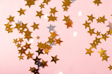 Naklejka na ściany i meble golden sparkles on a pink background, Christmas greeting postcard template 