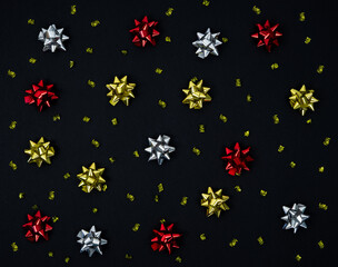 Fototapeta na wymiar Christmas bows for decoration on a black background.
