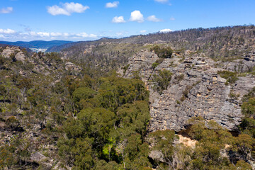 Fototapeta na wymiar Aerial view of forest regeneration in a valley in regional Australia