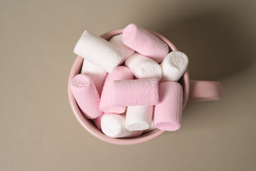 Pink cocoa glass filled with pink marshmallows