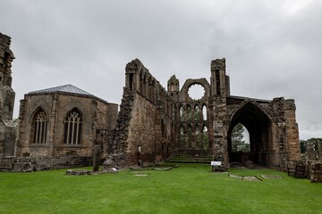 The courtyard of ancient Elgin Cathedral ruins at typical Scottish cloudy weather