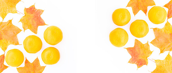 Creative background made of Yellow Fresh Orange fruits with Autumn Maple leaves, Pop art design on white ,Banner.