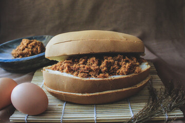 Beef floss bread, Dried shredded beef bread with eggs on a bamboo placemat