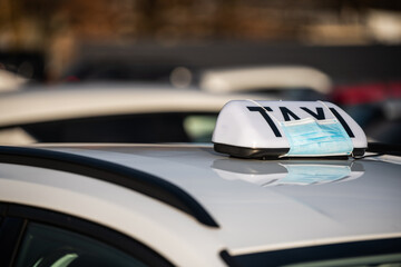taxi badge on the roof - protests - tightening after the covid 19 coronavirus pandemic