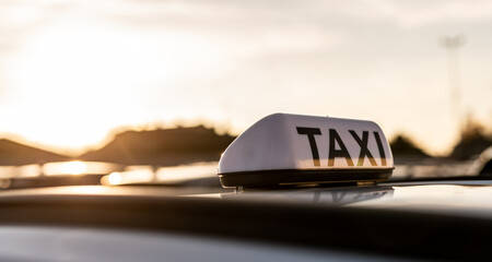 Taxi sign during the sunset