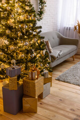Beautiful holdiay decorated room with Christmas tree with presents under it