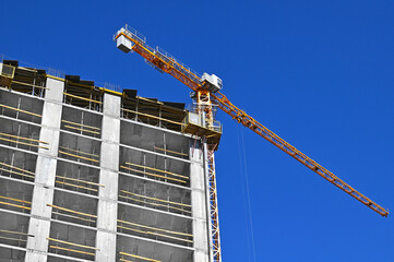 Crane and highrise construction site