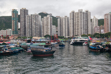 Fototapeta na wymiar Aberdeen Harbour seen from Ap Lei Chau Bridge, In this area you will find fishing boats, houseboats, and sampans, The bay between the south coast of Hong Kong Island