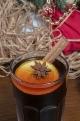 Warming winter drink with a cinnamon stick. Cinnamon and star anise drinks. Close-up.