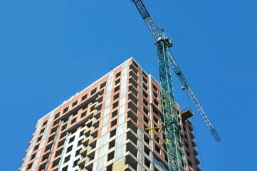 Crane and highrise construction site