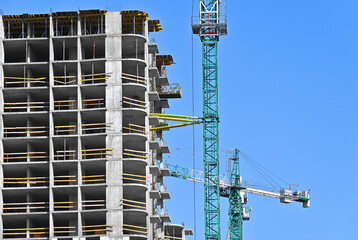 Crane and highrise construction site