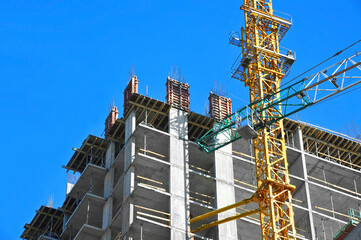 Crane and highrise construction site