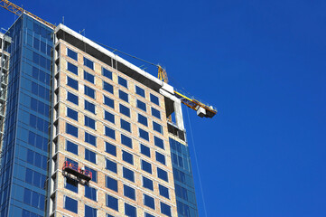 Crane and highrise construction site