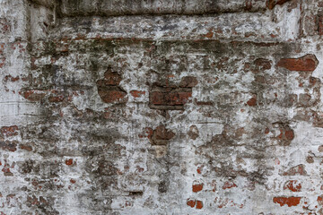 Destroyed surface of a white brick wall. Background. Space for text.