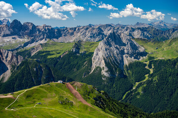 Fototapeta na wymiar Beautiful alpine countryside. Scenic image of famous Sassolungo peak with overcast perfect blue sky. Wonderful Vall Gardena under sunlight. Majestic Dolomites Mountains. Amazing nature Landscape