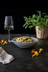 Risotto with chanterelles and saga leaves. Risotto and white wine
