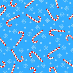 Candy seamless pattern. Sweet vector pattern with candy cane and snowflakes on a blue background. For the design of fabrics, packaging and wrapping. For the holiday Christmas.