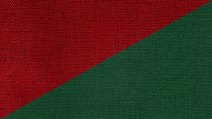 half-half red and green linen fabric texture in oblique line background. red and green sackcloth flag background. abstract christmac concept background.