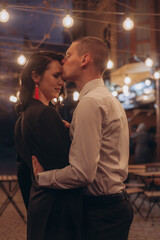 couple kiss at night on the street