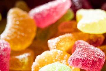 Marmalade of different colors, in the rays of the sun