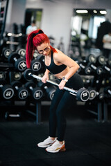 Fototapeta na wymiar fitness sexy woman training with barbell in gym. Female athlete working out, barbell gym workout