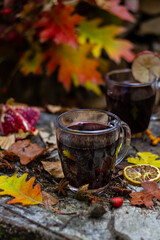 Spicy mulled wine with orange, cinnamon and anise. Autumn background