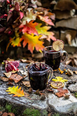 Spicy mulled wine with orange, cinnamon and anise. Autumn background