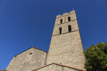 Obraz premium Church Notre-Dame del Prat (1178) in Argeles-sur-Mer. In XIV century Notre-Dame rebuilt and equipped with a beautiful bell tower. Argeles-sur-Mer, Pyrenees Orientales, Languedoc Roussillon, France.