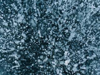 transparent lake Baikal ice with gas bubbles frozen in it