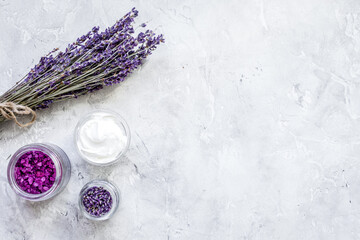 Obraz na płótnie Canvas organic cosmetic with lavender salt on stone background top view mock up