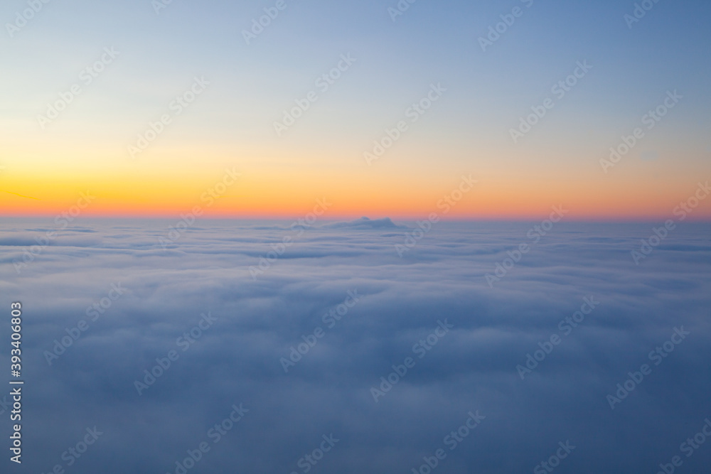 Wall mural amazing sunrise above clouds from the top of the mountain