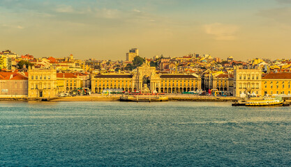 A close up view from the river Tagus towards the Commercial Square, Lisbon, Portugal in the early morning light at sunrise in Autumn