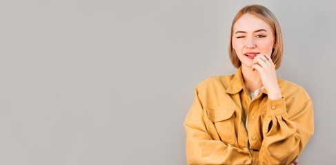 Portrait of attractive happy woman winking and flirting