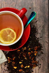 Top view of a cup of black tea with lemon