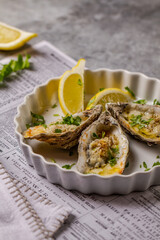 Oven baked oysters with lemon