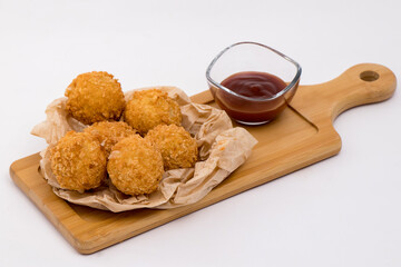 cheese balls and tomato sauce