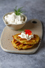 Hash Browns with Sour Cream, Dill and Red Caviar. Potato pancakes