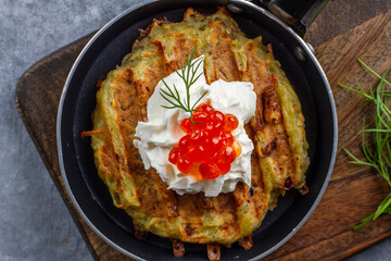 Hash Browns with Sour Cream, Dill and Red Caviar. Potato pancakes