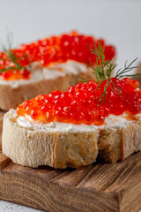 Fresh red caviar on bread. Sandwiches with red caviar.