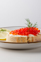 Fresh red caviar on bread. Sandwich with red caviar.