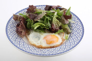 fried egg with lettuce salad as diet dish