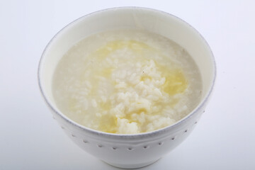 white rice bawl soup with olive oil as diet concept