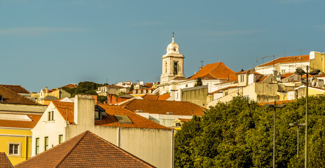 Fototapeta premium A view across the roof tops of the old quarter of Lisbon, Portugal in Autumn