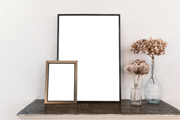 Empty picture frames on wooden shelf. Frame mockup..