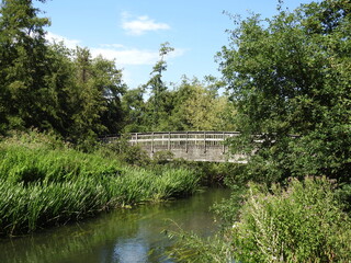 View of the wooden bridge and a footbridge across the river